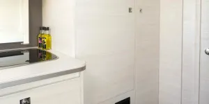 A-good-sized-wardrobe-with-a-shelved-cabinet-alongside-it-35288