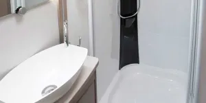Style-is-in-plentiful-supply-here-with-a-surface-mounted-basin-and-a-black-panel-in-the-shower-49742