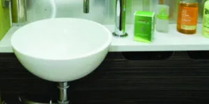 A-small-washbasin---and-a-built-in-soap-dispenser-on-the-wall-w350-70454