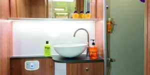 Brilliant-lighting-and-plenty-of-shelves-in-the-shower-room-88089
