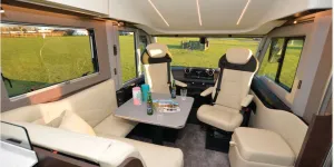 The Adria Supersonic 780 SL A-class motorhome lounge with bed above