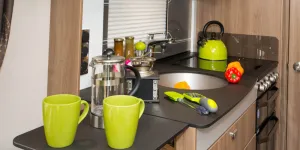 web-3-The-kitchen-surface-is-Italian-made-acrylic-resin,-designed-to-resist-scratches,-and-only-about-a-centimetre-deep-26764