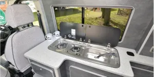 The Custom Built Campervans high-top rising roof campervan kitchen