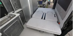 The Custom Built Campervans high-top rising roof campervan bed