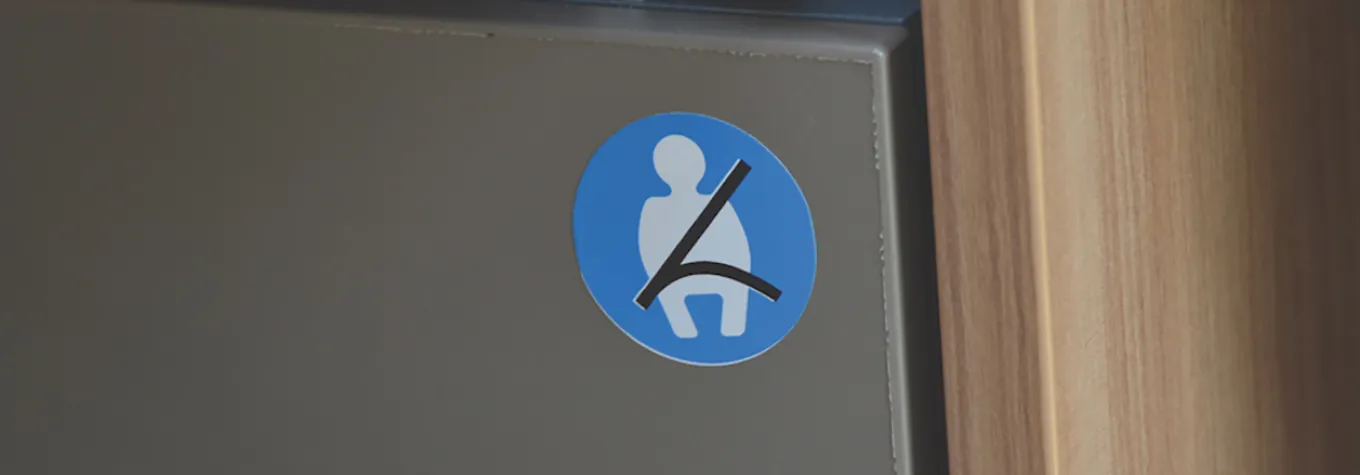 Motorhome seatbelt sticker on a seat base