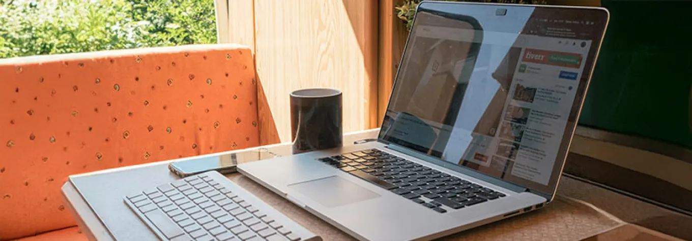 Laptop open on a motorhome table