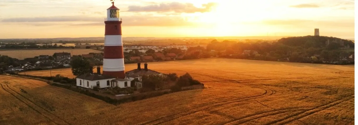 A lighthouse in the sunset