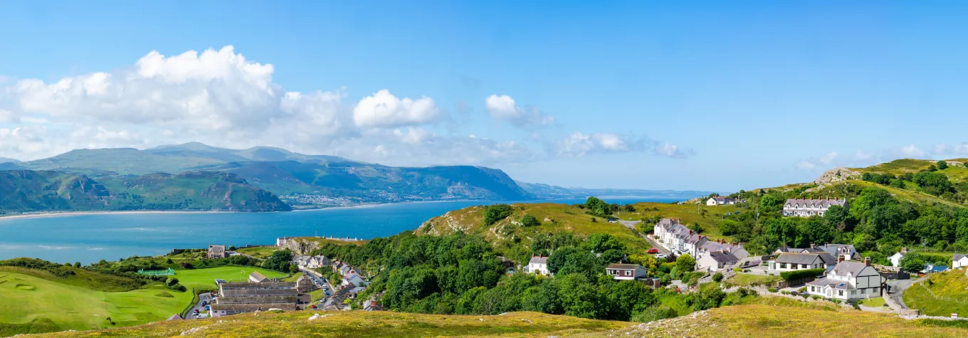 Wide panoramic view of Welsh countryside and coast from Great Orme headland near Llandudno, Wales