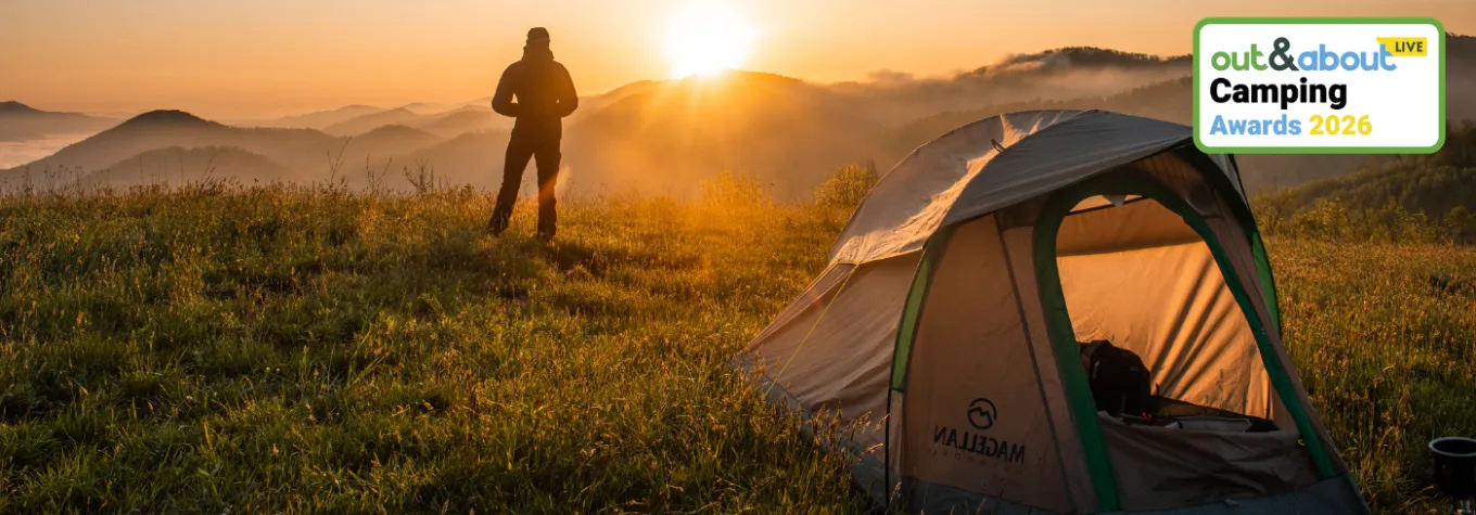Tent pitched up on scenic hillside