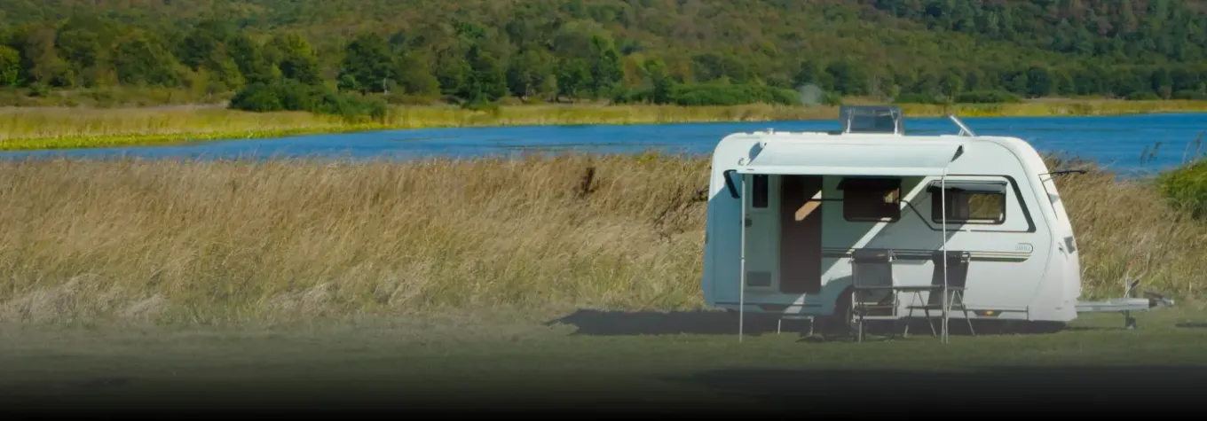 image of a caravan on a field
