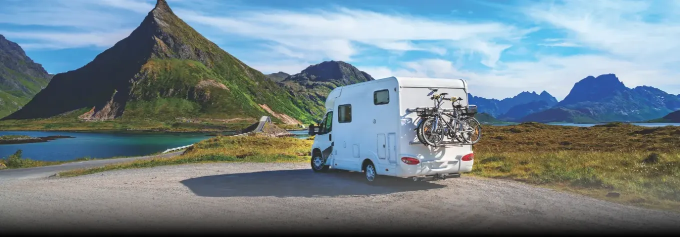 image of a motorhome with a mountain backdrop