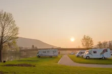 image of a campsite with motorhomes parked 
