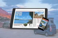 A tablet and smartphone displaying the digital Campervan magazine, set against a scenic outdoor backdrop with campervans and mountains.