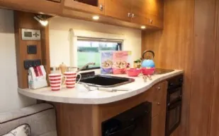 rhp_Ample upper and lower storage space in the kitchen and more in the dresser opposite