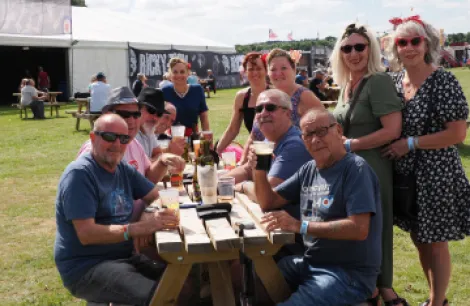 Group of friends enjoying a drink in the food court 