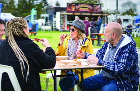 People eating at campervan campout