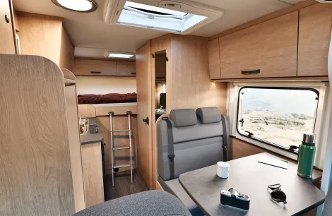 Sunlight V60 front front to rear showing lounge and ladder to fixed transverse bed