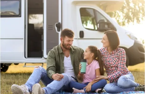 A family outside of a motorhome