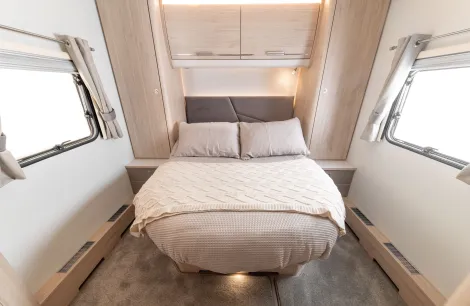 A cozy bedroom inside the Elddis Crusader Aurora