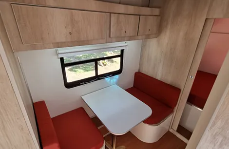 A roomy dining area inside the Pbarbus 450