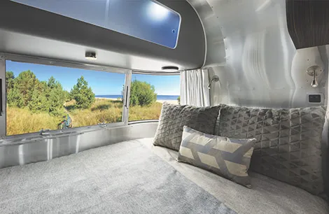 A spacious double bed inside the Airstream Tourer Range