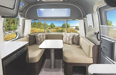 Inside, the finish is unmistakably Airstream: bright aluminium, wood and clean design