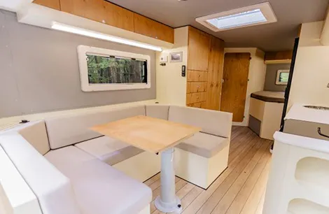 A luxury and quality made interior leading to a fixed bed and washroom inside the Crawler ALP 560