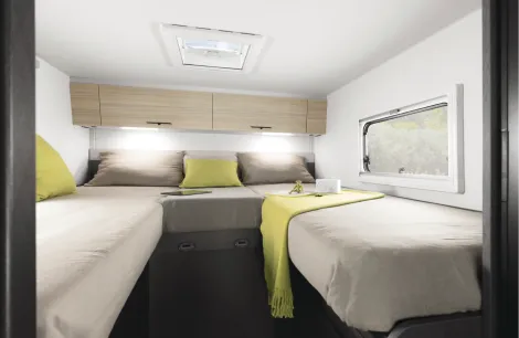 The bedroom inside a Etrusco Overcab motorhome