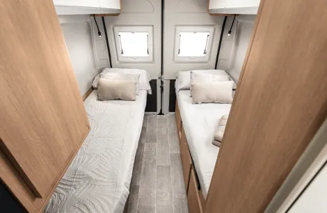 The bed inside the GiottiVan 64G