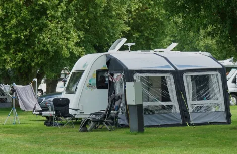 An exterior shot of a caravan with an awning