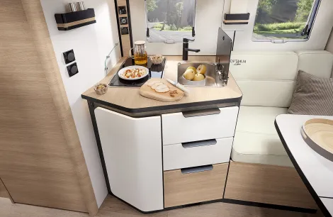 Rapido C66 Optimum Line showing face to face lounge sofa and kitchen