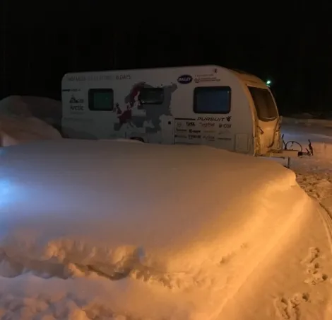 A caravan in the winter night