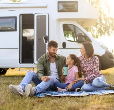 A family outside of a motorhome