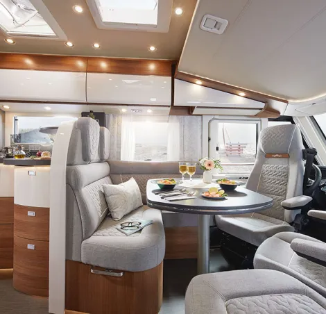 Carthago C2-tourer lounge and kitchen (I 147 RB-LE L Comfort model shown)