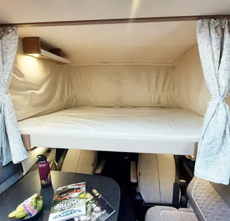 Carthago C2-tourer drop-down bed in the cab as seen in I 148 RB-QB L Comfort model