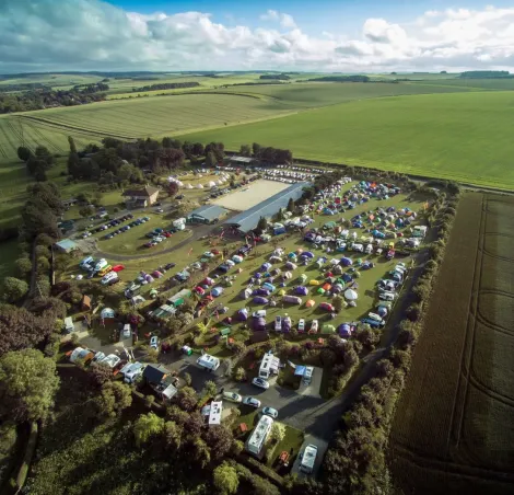a drone shot of Stonehenge campsite