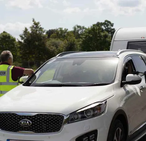 a caravan being towed, driver on a course learning how to tow