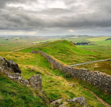 Crags and Hadrian's Wall at Caw Gap. Hadrian's Wall is a UNESCO World Heritage Site in the beautiful Northumberland National Park. Popular with walkers along the Hadrian's Wall Path and the Pennine Way.