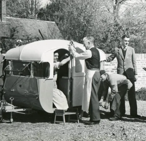 The Royal Caravan with its design and construction team at Rollalong Caravans Limited of Ringwood, Hampshire in 1955.