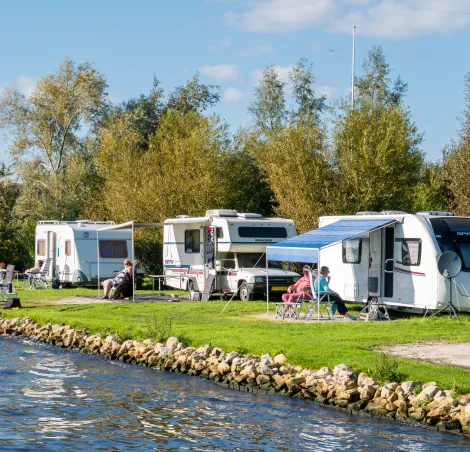a caravan campsite by a stream