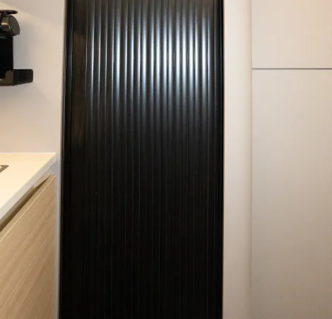 A tambour door closes off the shower room