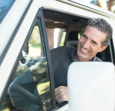 Man smiling in a campervan