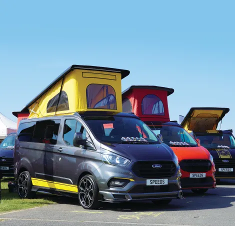 image of a group of campervans lined up