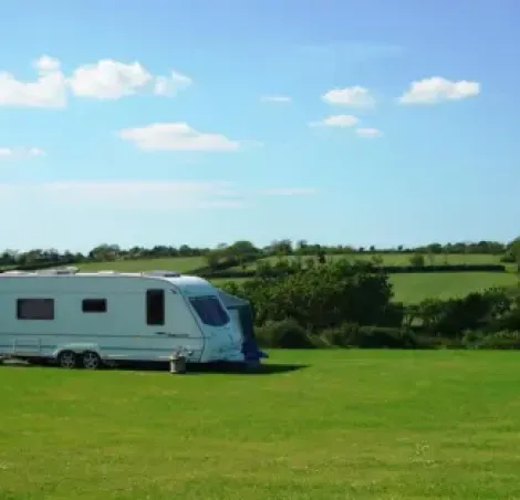 image of a caravan set up on a pitch