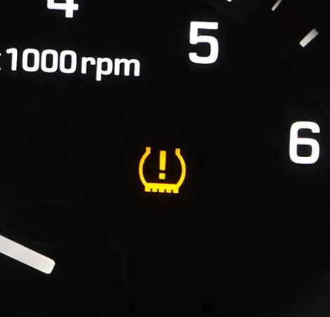 Tyre pressure warning light on a dashboard