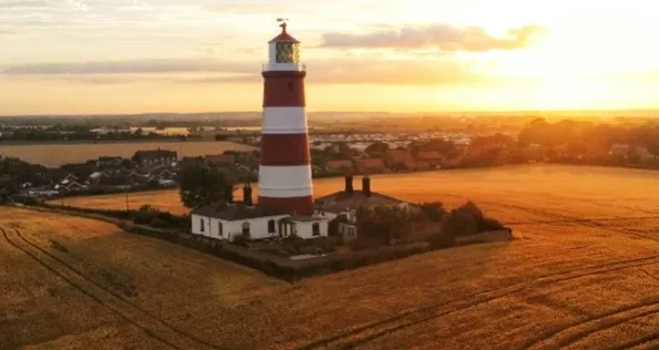 A lighthouse in the sunset