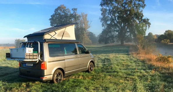 Campervan by river