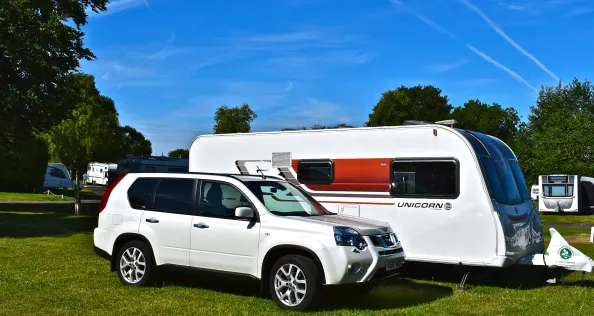 Winchester, Hampshire / England - 17/17/2017 : A modern car and caravan outfit at Winchester Caravan & Motorhome Club Site in the summertime.