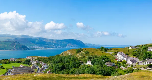 Wide panoramic view of Welsh countryside and coast from Great Orme headland near Llandudno, Wales
