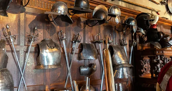 Medieval weapons and armor and Interior of Warwick Castle - is a medieval castle built by William the Conqueror in 1068, UK